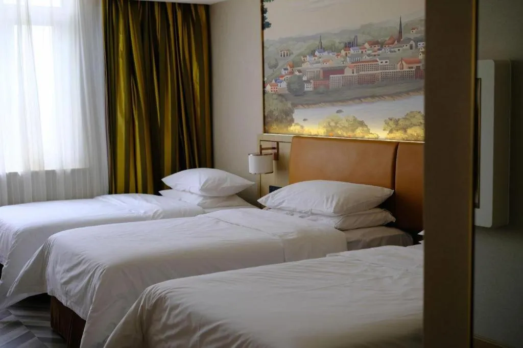 Bed in Vienna Hotel Tianjin Huaming
