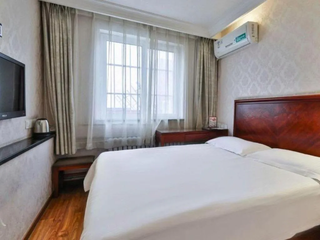 Bed in GreenTree Inn Beijing Daxing Xingye Street Liyuan Business Hotel