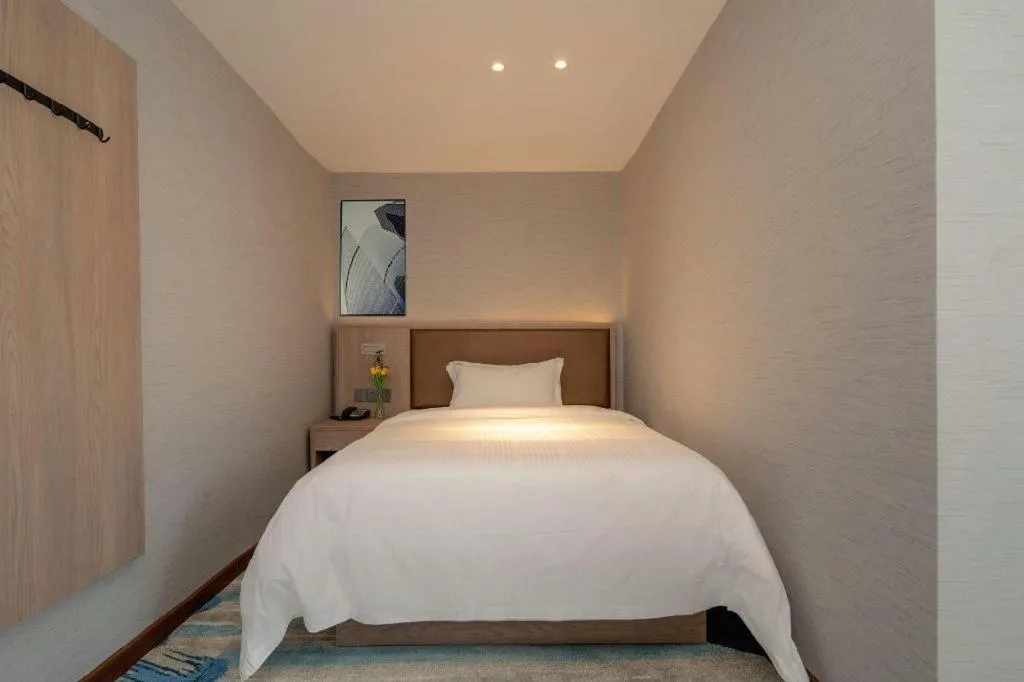 Bed in GreenTree Inn Ganzhou Sankang Temple DaRunFa Express Hotel