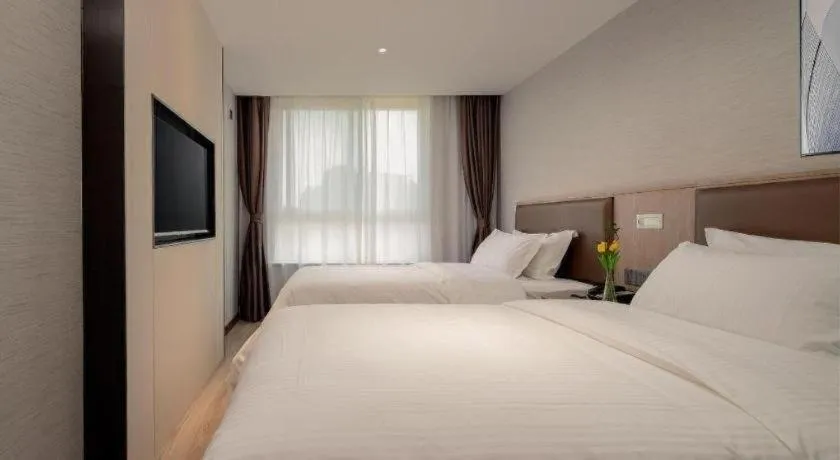 Bed in GreenTree Inn Ganzhou Sankang Temple DaRunFa Express Hotel