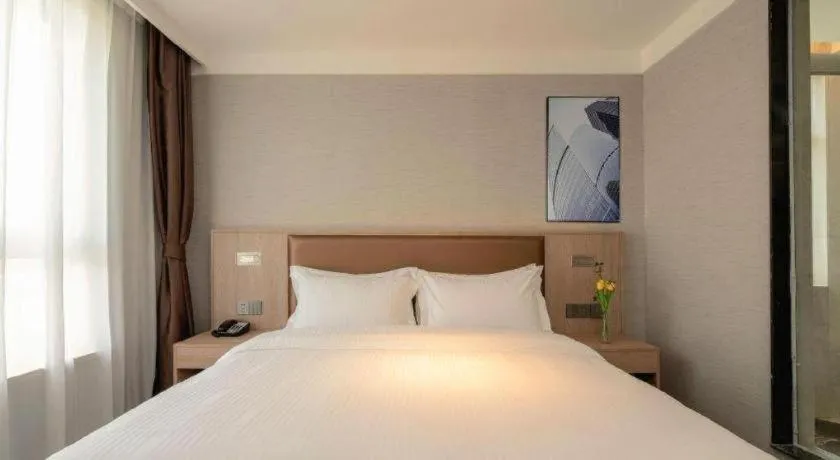 Bed in GreenTree Inn Ganzhou Sankang Temple DaRunFa Express Hotel