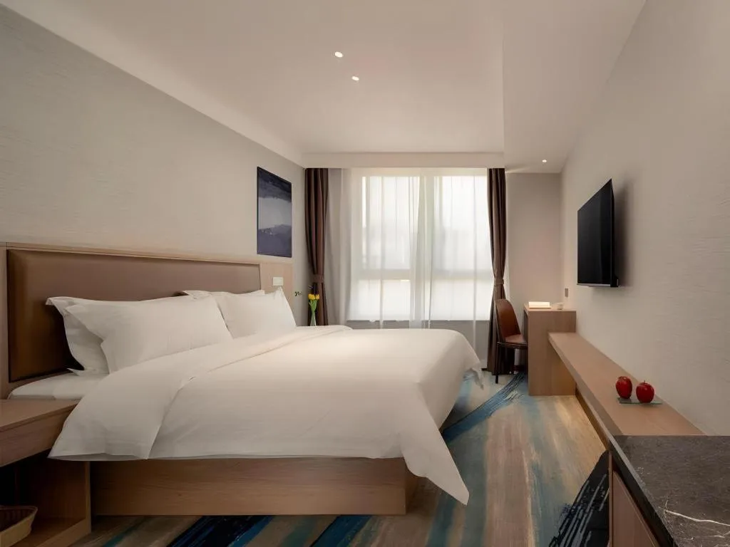 Bed in GreenTree Inn Ganzhou Sankang Temple DaRunFa Express Hotel