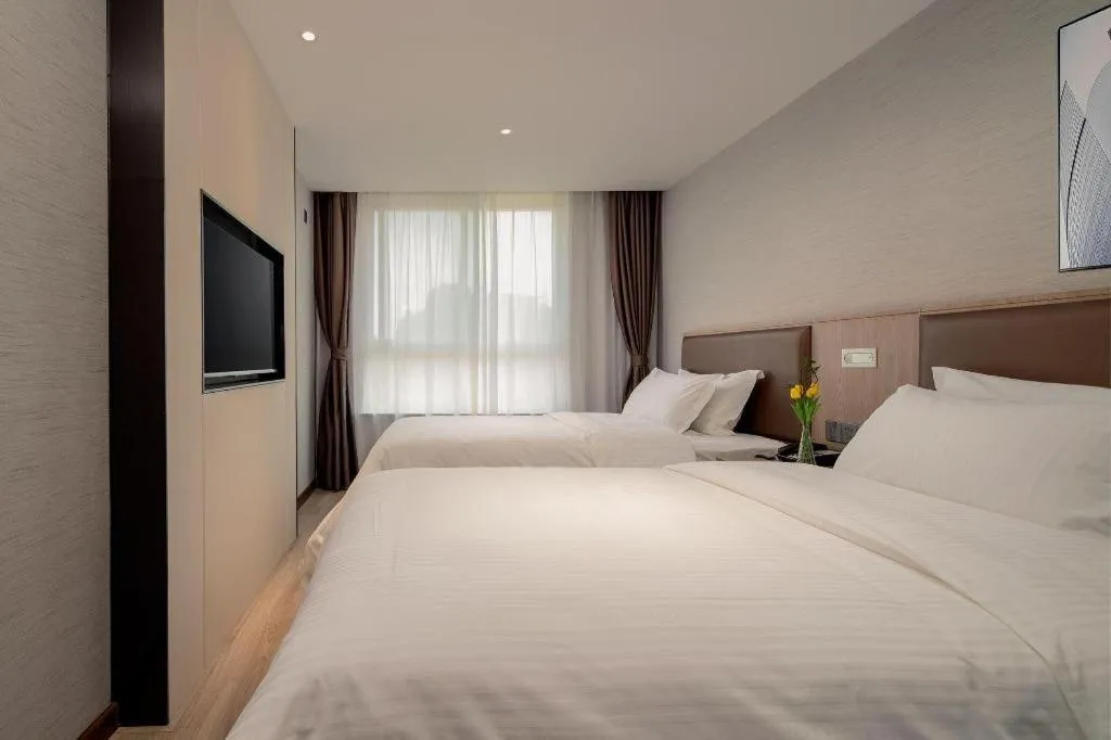 Bed in GreenTree Inn Ganzhou Sankang Temple DaRunFa Express Hotel