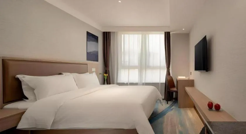 Bed in GreenTree Inn Ganzhou Sankang Temple DaRunFa Express Hotel