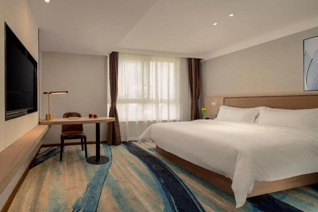 Bed in GreenTree Inn Ganzhou Sankang Temple DaRunFa Express Hotel