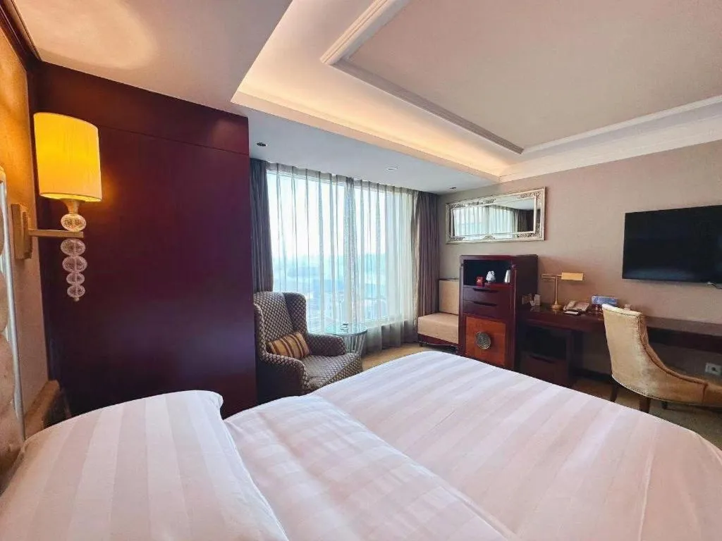 Bed in Shenyang Royal Wan Xin Hotel