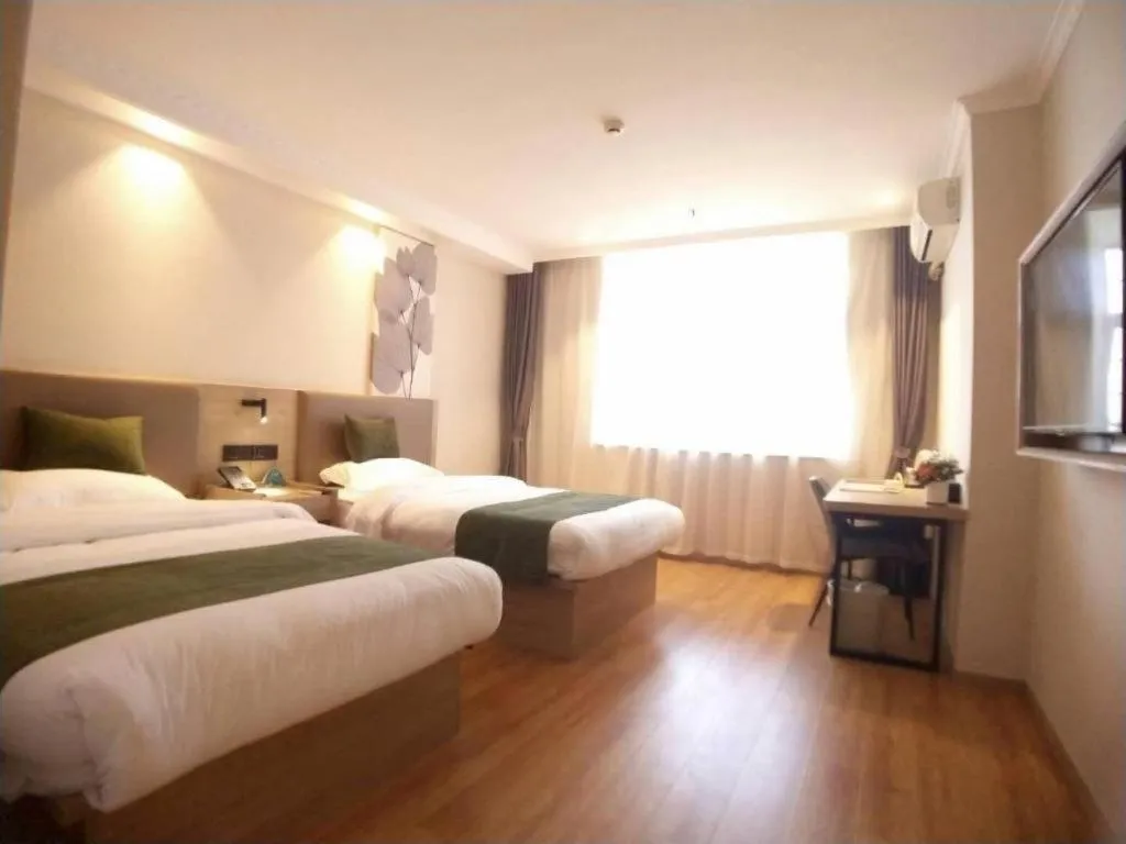 Bed in GreenTree Inn Xuzhou High Speed Railway Station Express Hotel