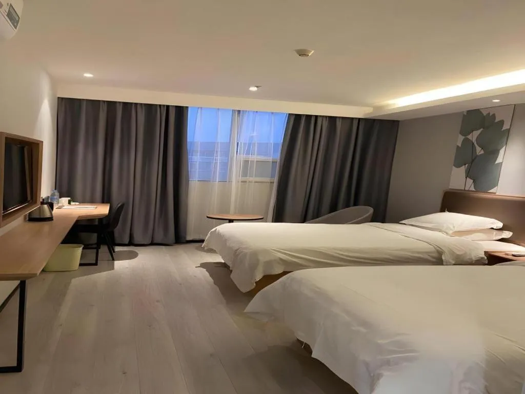 Bed in GreenTree Inn Nanjing Dachang Getang Metro Station Express Hotel