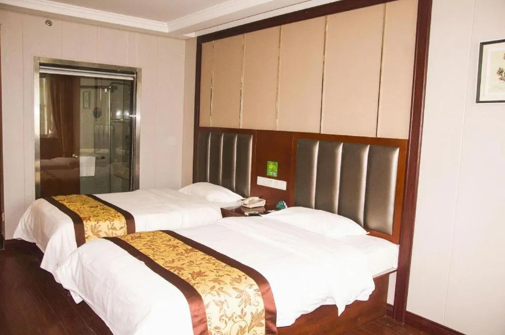 Bed in GreenTree Inn JiangSu Wuxi Jiangyin City QinGYAng Town Fuqian Road Express Hotel