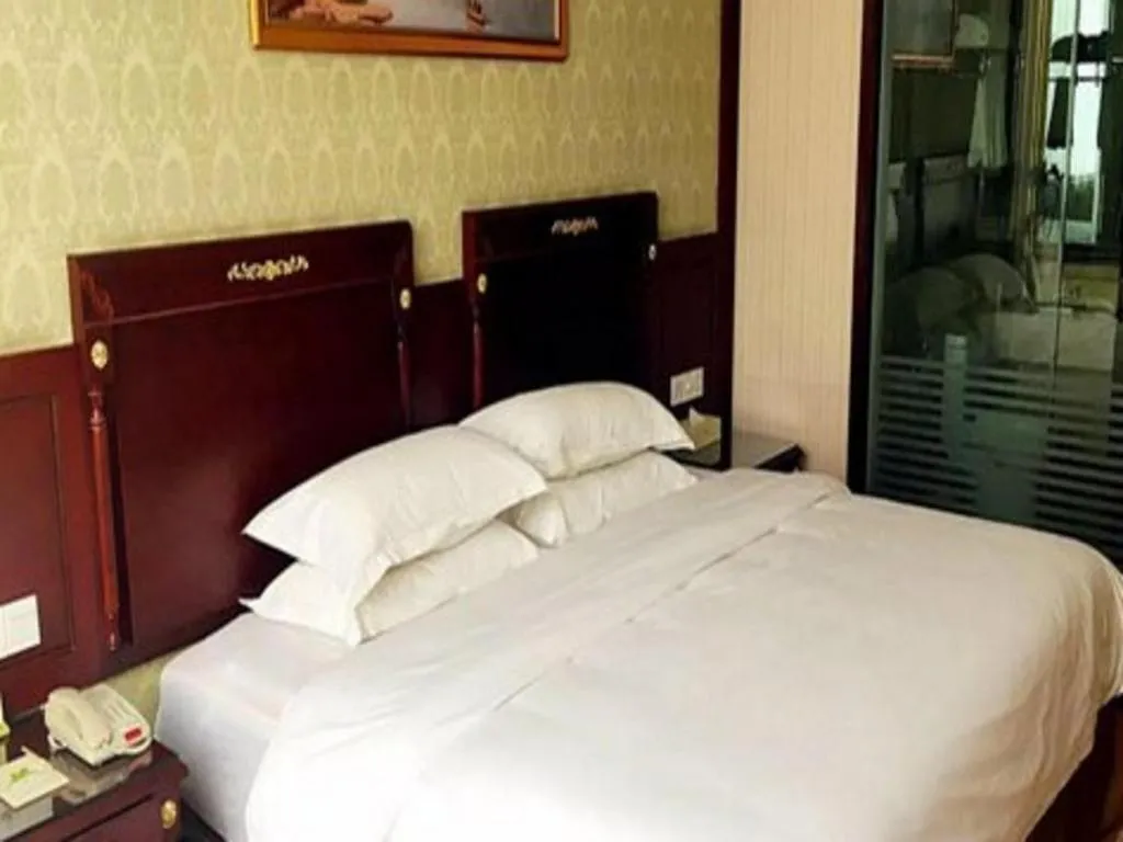 Bed in Vienna Hotel Qingdao Jiaozhou Branch