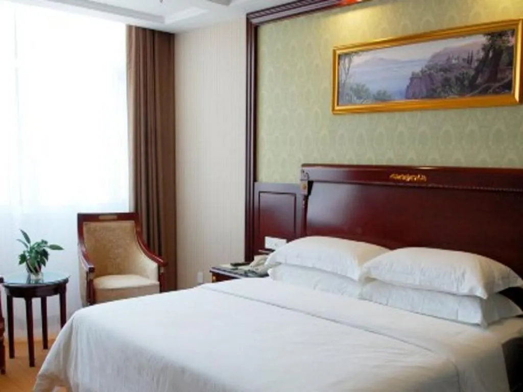Bed in Vienna Hotel Qingdao Jiaozhou Branch