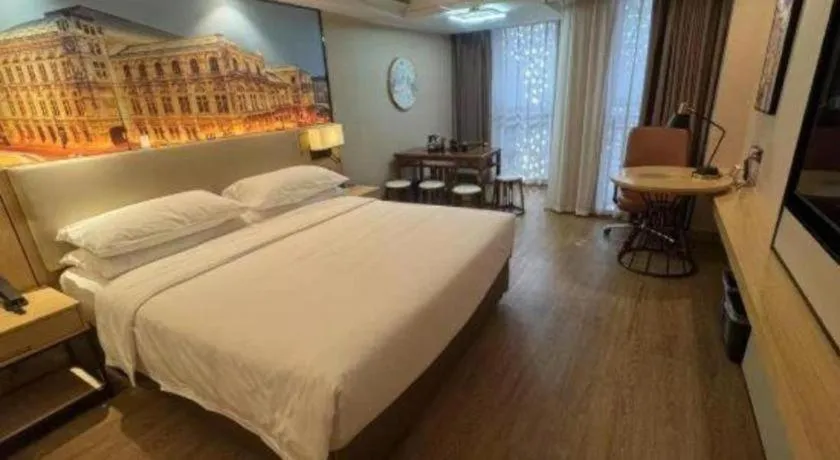 Bed in Vienna International Hotel Guangzhou Baiyun Dayuanli Plaza