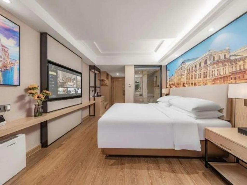 Bed in Vienna International Hotel Guangzhou Baiyun Dayuanli Plaza