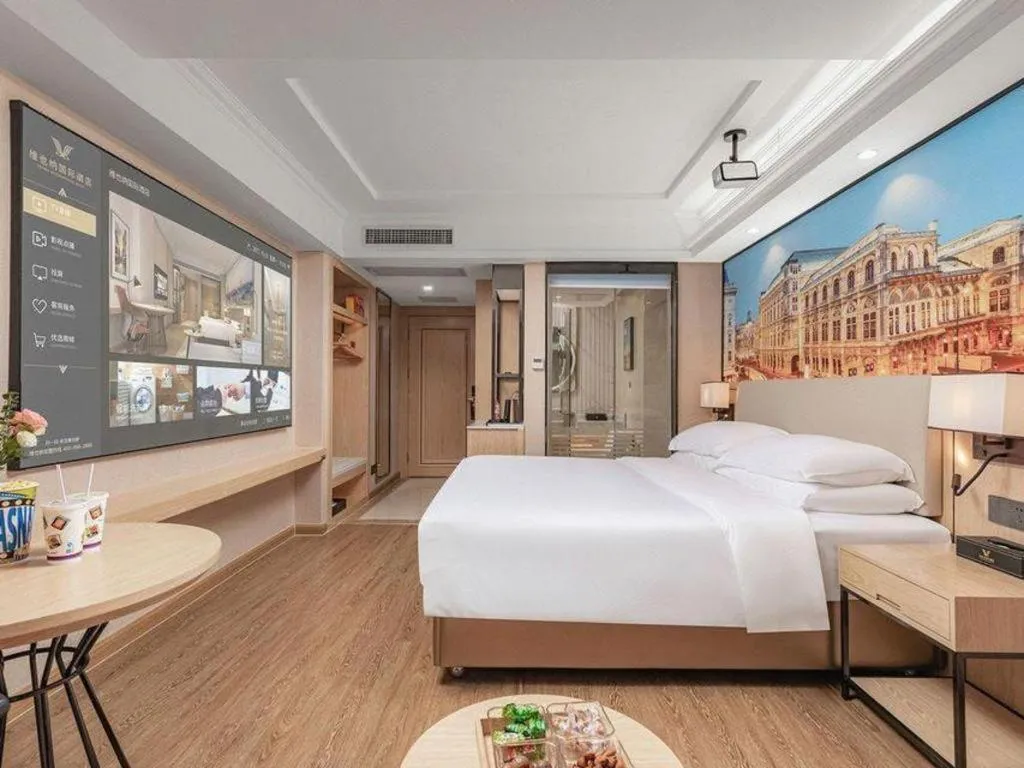 Bed in Vienna International Hotel Guangzhou Baiyun Dayuanli Plaza