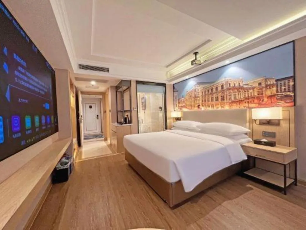 Bed in Vienna International Hotel Guangzhou Baiyun Dayuanli Plaza