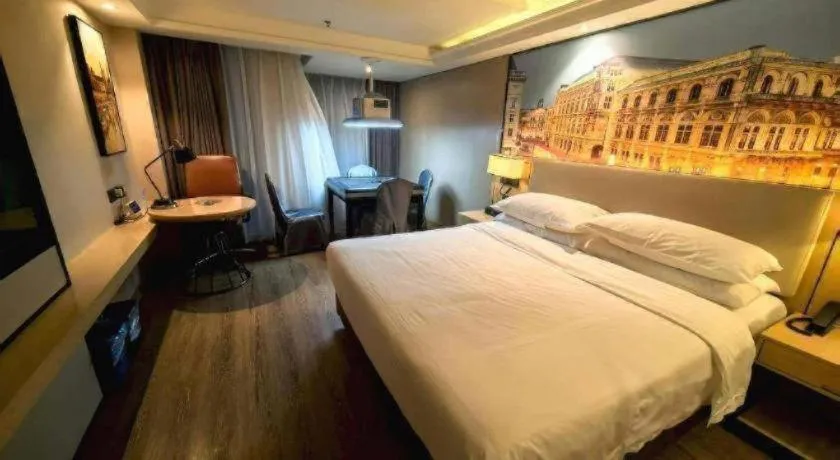 Bed in Vienna International Hotel Guangzhou Baiyun Dayuanli Plaza