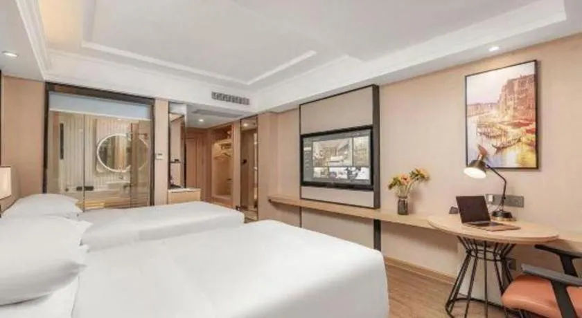 Bed in Vienna International Hotel Guangzhou Baiyun Dayuanli Plaza