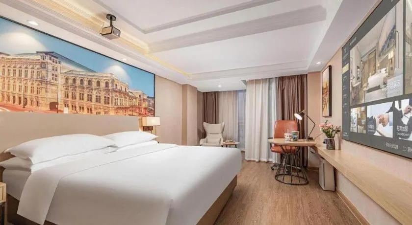 Bed in Vienna International Hotel Guangzhou Baiyun Dayuanli Plaza