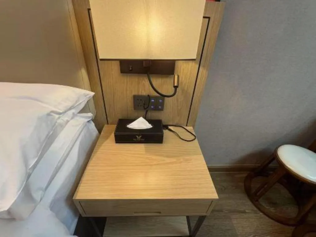 Bed in Vienna International Hotel Guangzhou Baiyun Dayuanli Plaza