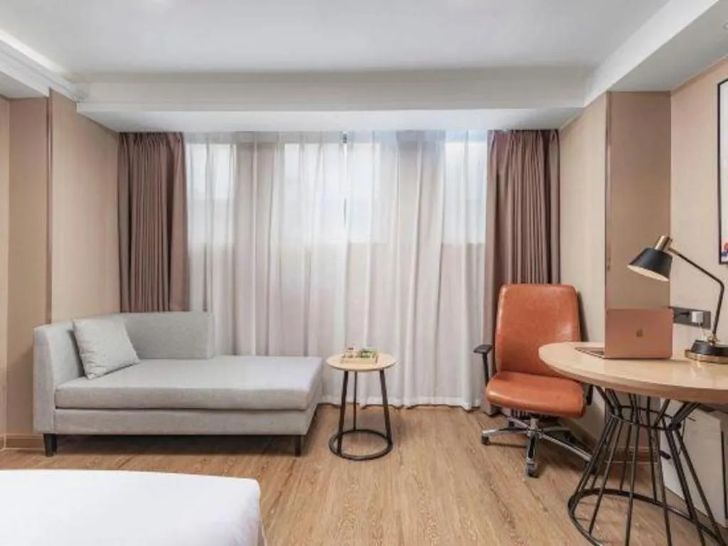 Bed in Vienna International Hotel Guangzhou Baiyun Dayuanli Plaza