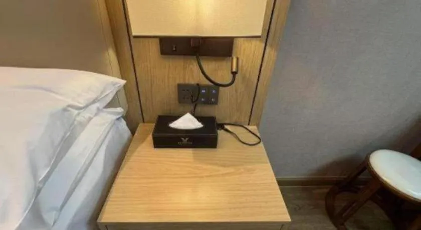 Bed in Vienna International Hotel Guangzhou Baiyun Dayuanli Plaza