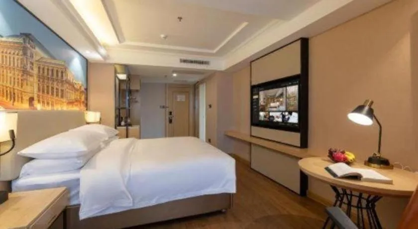 Bed in Vienna International Hotel Guangzhou Baiyun Dayuanli Plaza