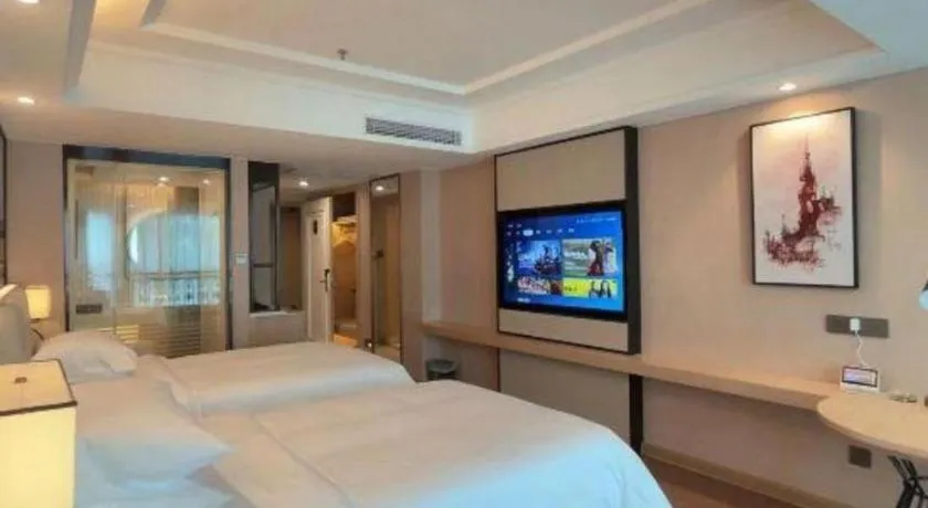 Bed in Vienna International Hotel Guangzhou Baiyun Dayuanli Plaza