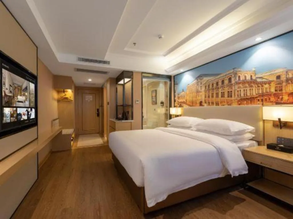 Bed in Vienna International Hotel Guangzhou Baiyun Dayuanli Plaza
