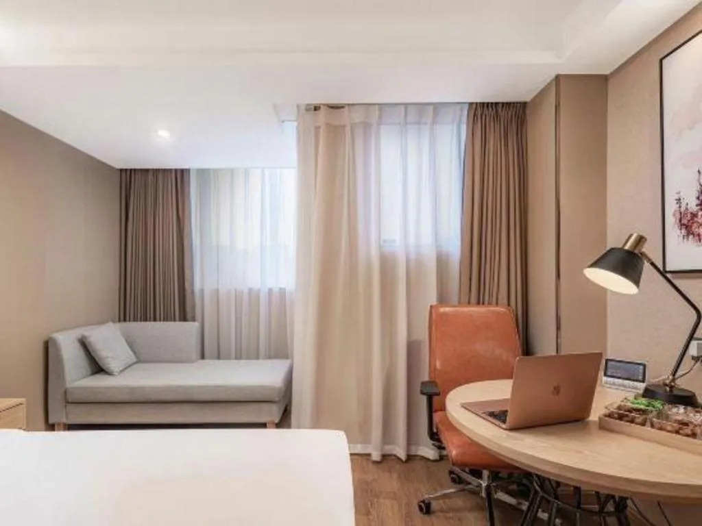 Bed in Vienna International Hotel Guangzhou Baiyun Dayuanli Plaza