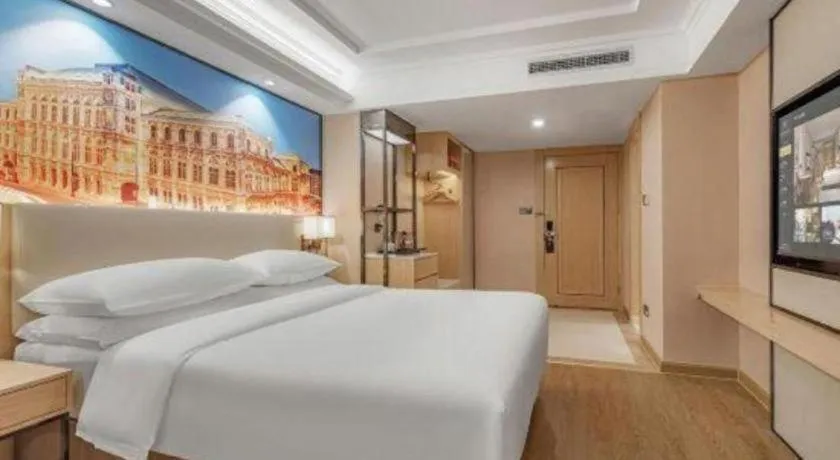 Bed in Vienna International Hotel Guangzhou Baiyun Dayuanli Plaza