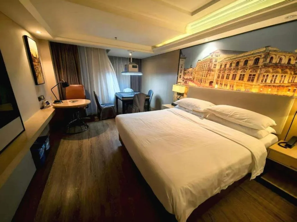 Bed in Vienna International Hotel Guangzhou Baiyun Dayuanli Plaza