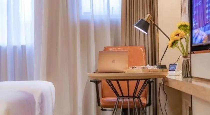 Bed in Vienna International Hotel Guangzhou Baiyun Dayuanli Plaza