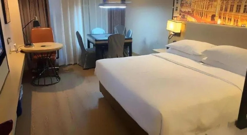 Bed in Vienna International Hotel Guangzhou Baiyun Dayuanli Plaza