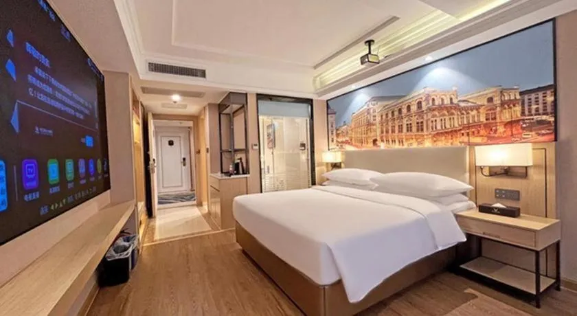 Bed in Vienna International Hotel Guangzhou Baiyun Dayuanli Plaza