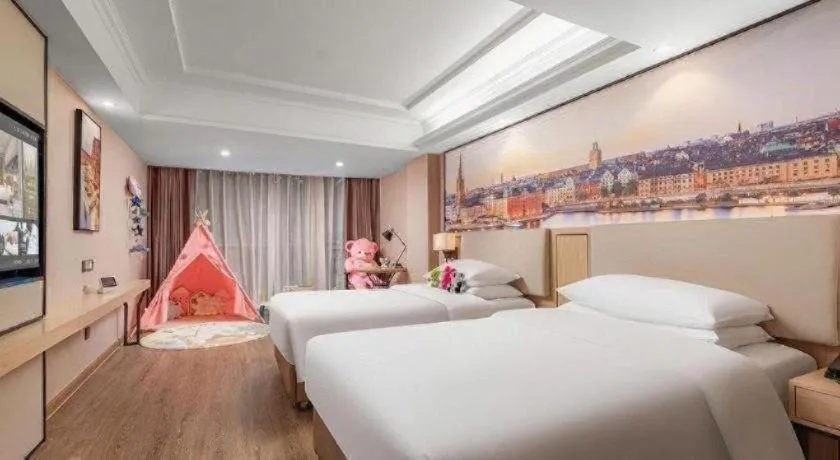 Bed in Vienna International Hotel Guangzhou Baiyun Dayuanli Plaza
