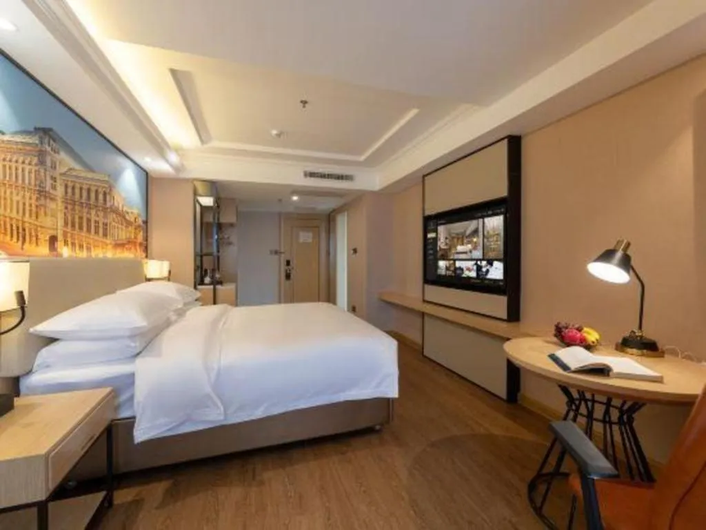 Bed in Vienna International Hotel Guangzhou Baiyun Dayuanli Plaza