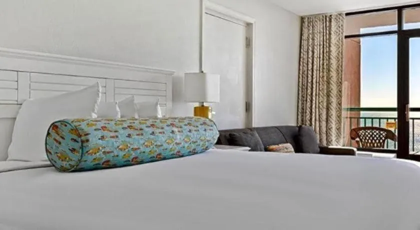 Bed in Sand Castle Resort by Patton Hospitality