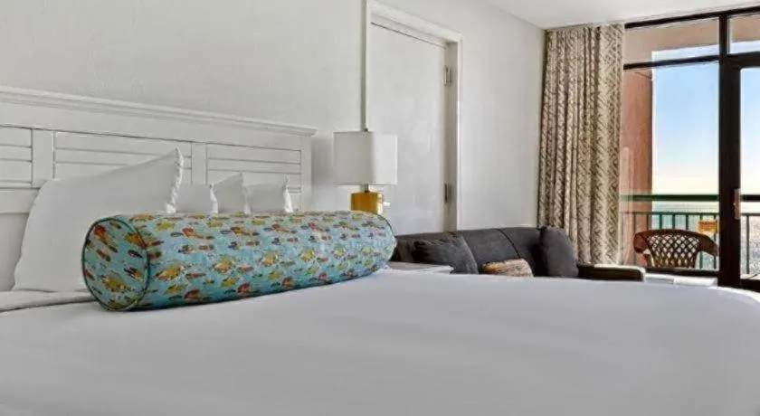 Bed in Sand Castle Resort by Patton Hospitality