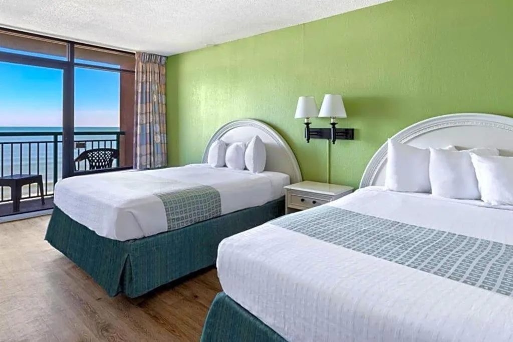 Bed in Sand Castle Resort by Patton Hospitality