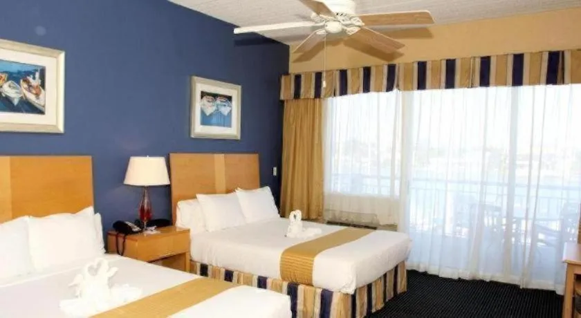 Bed in Chart House Suites and Marina