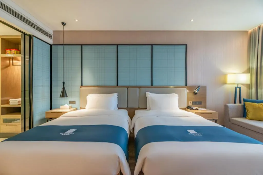Bed in Echarm Hotel Jinan Railway Station Daming Lake