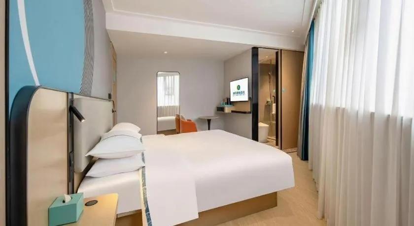 Bed in City Comfort Inn Wuzhou Municipal Square