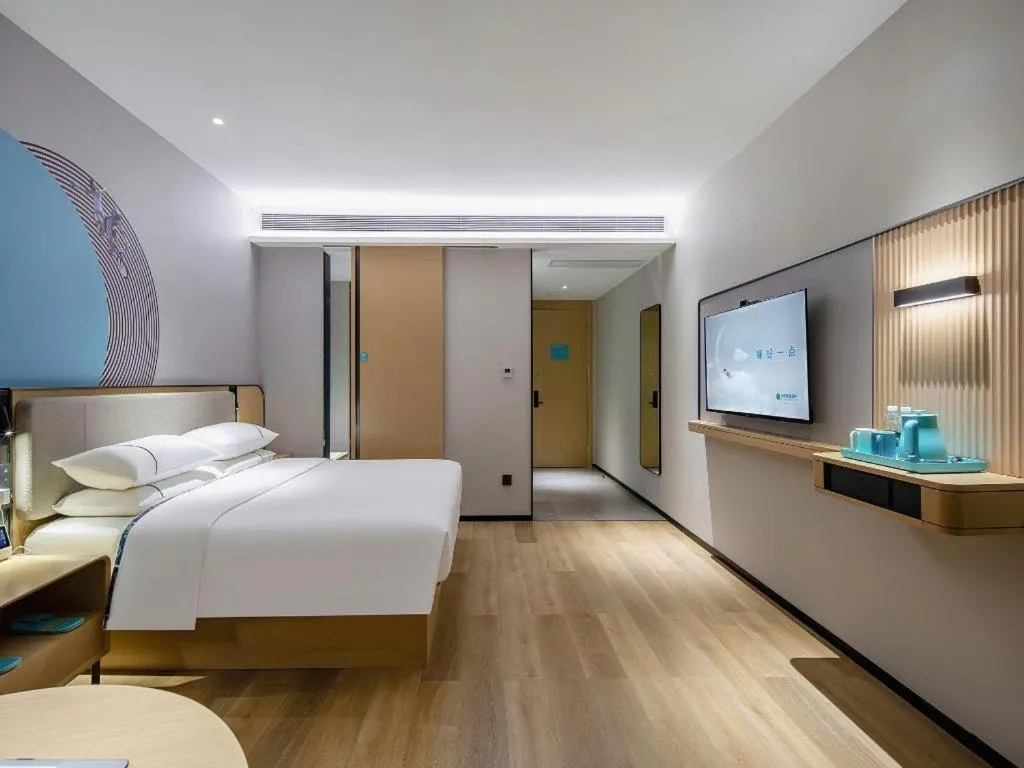 Bed in City Comfort Inn Wuzhou Municipal Square