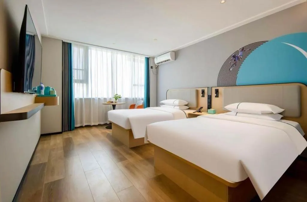 Bed in City Comfort Inn Wuzhou Municipal Square