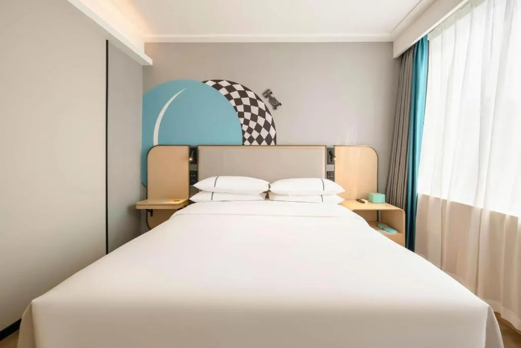 Bed in City Comfort Inn Wuzhou Municipal Square