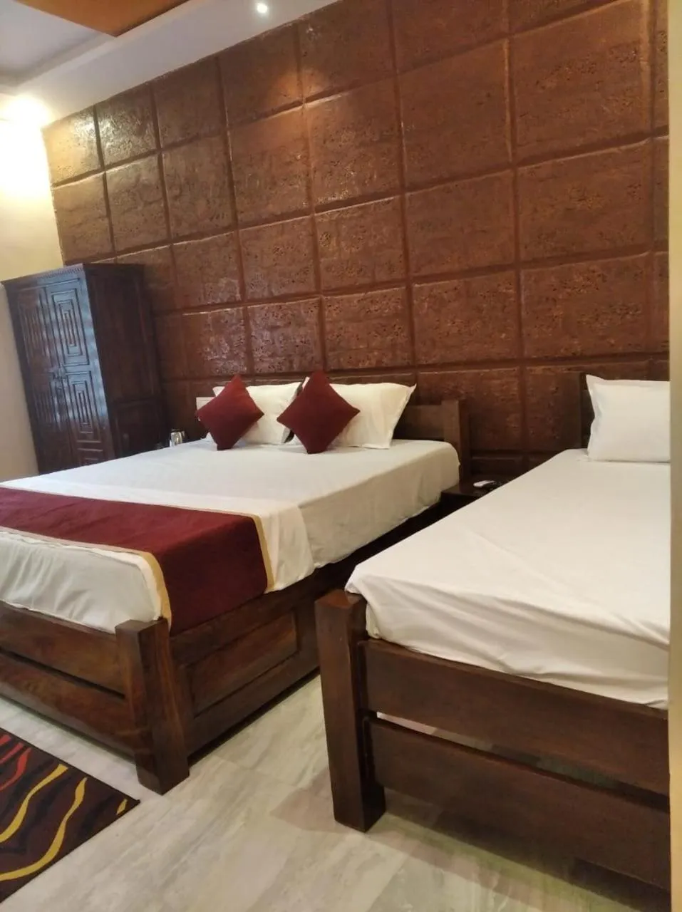 Bed in Kokan Heritage Resort