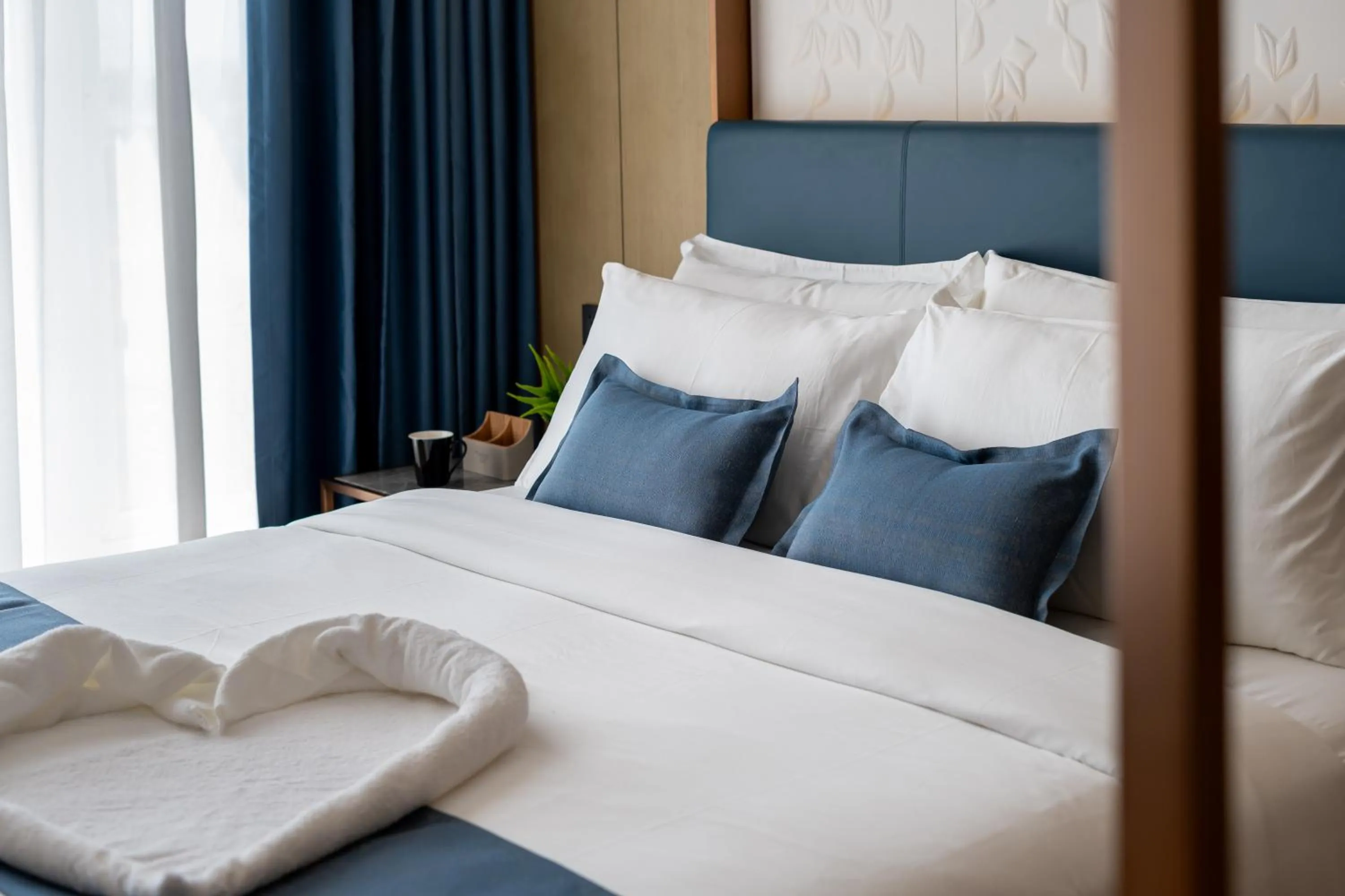 Bed in Copper Leaf Hotels, Tirunelveli