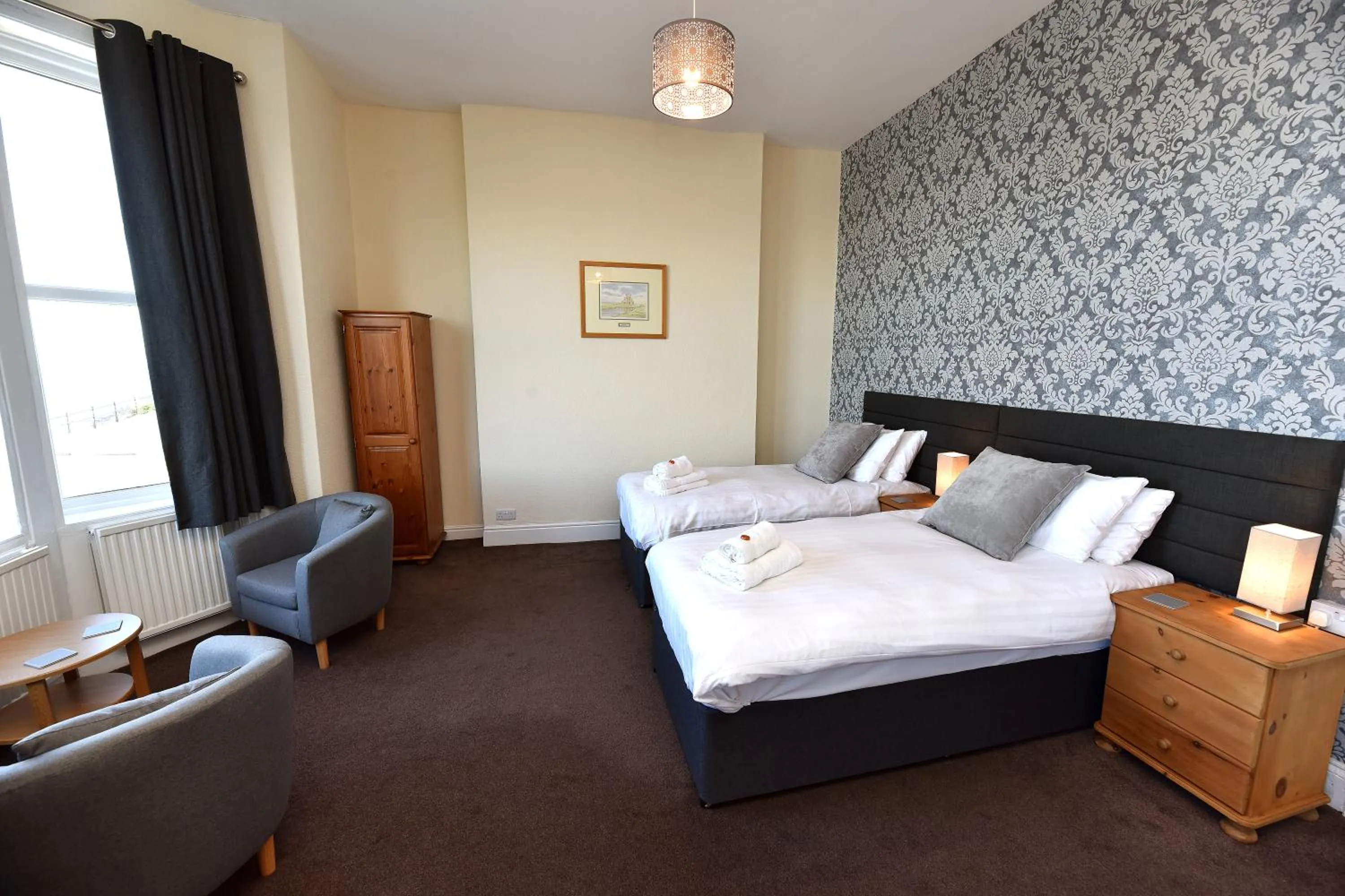 Bed in Phoenix Court Hotel