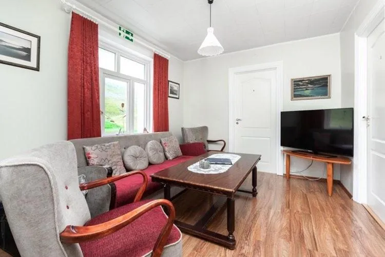 Communal lounge/ TV room in Mjoeyri Travel Holiday Homes