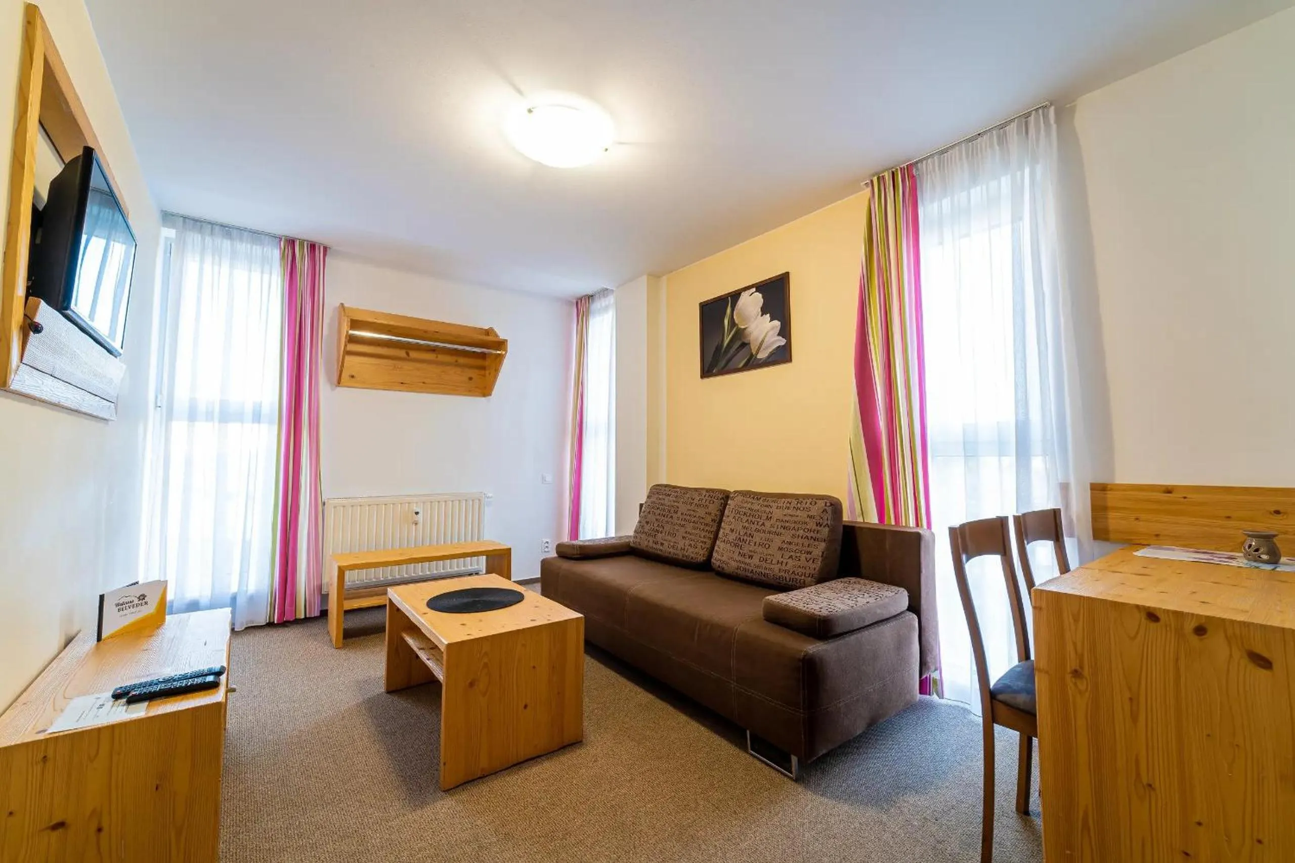 Communal lounge/ TV room in Aparthotel Belveder